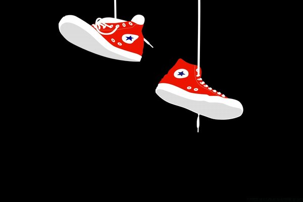 Hanging red sneakers on laces