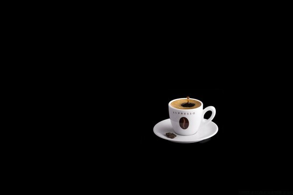 A cup of strong coffee on a black background