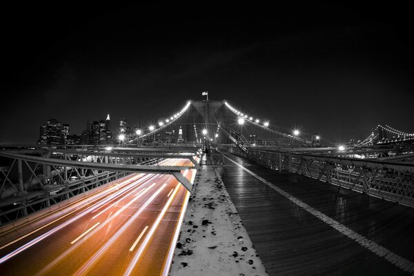 Motorway on the illuminated bridge at night