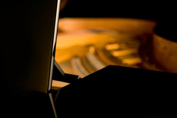 Blurred dark background and light from the piano