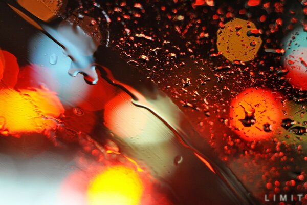 Rainbow colors on glass with water