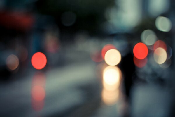 Blurry image of a city road with lanterns