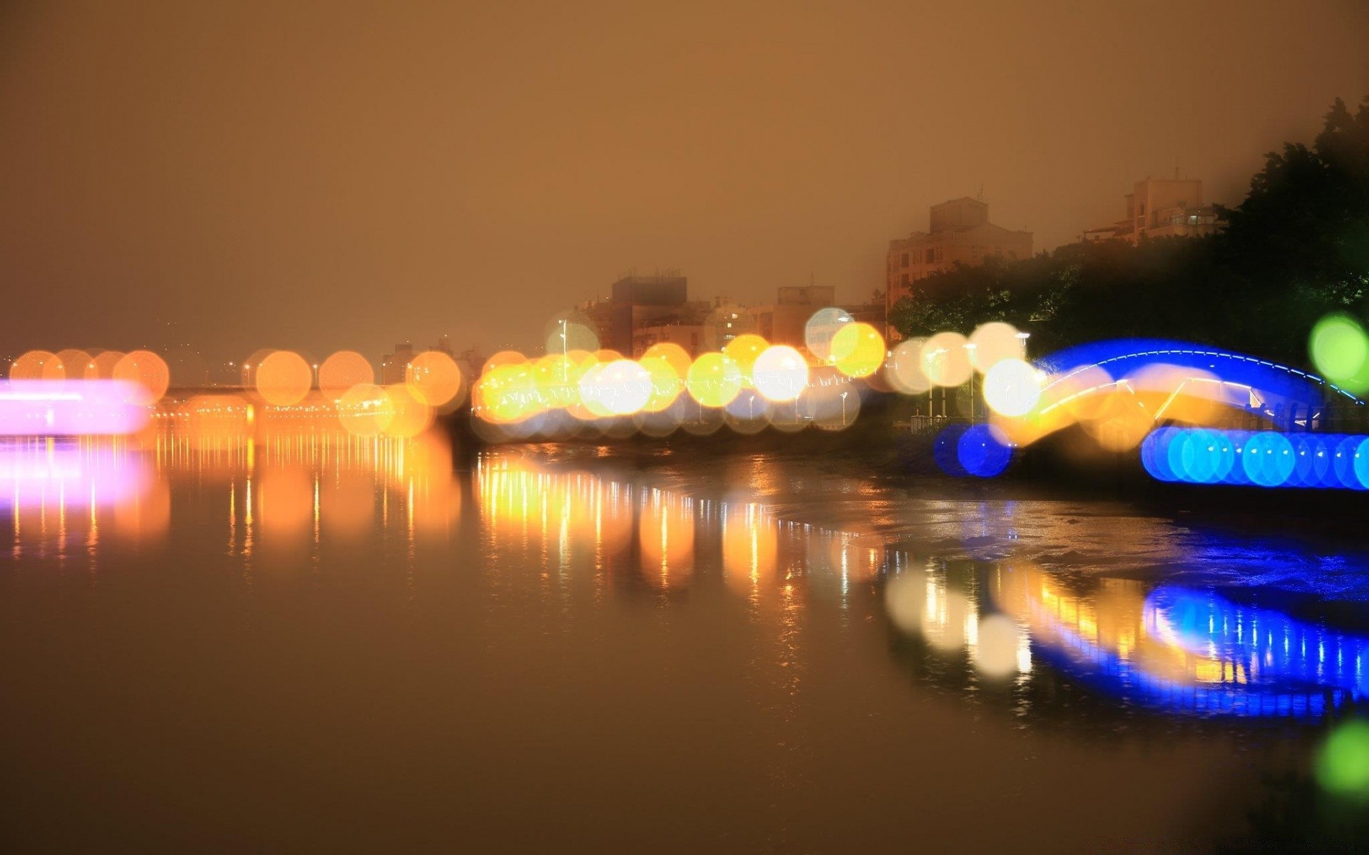 bokeh tramonto acqua sera crepuscolo luce cielo illuminato riflessione scuro città mare alba viaggi sfocatura sole vacanza spiaggia all aperto