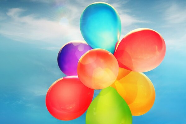 Colored balloons aim for the sky under the clouds