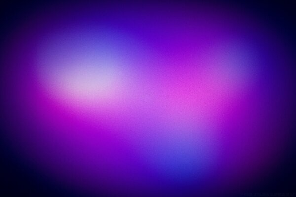 Two blurred lilac balls merge into one big blurred blue ball on a dark background