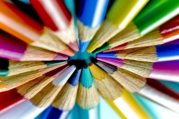 Sharp colored pencils laid out in a circle