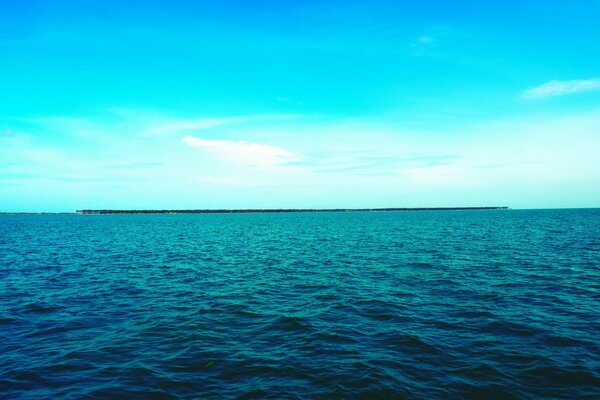 Blue ocean on a blue sky background