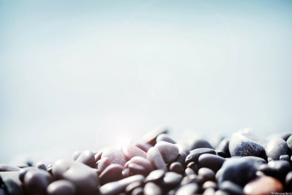 Blurry image of stones on a blue background