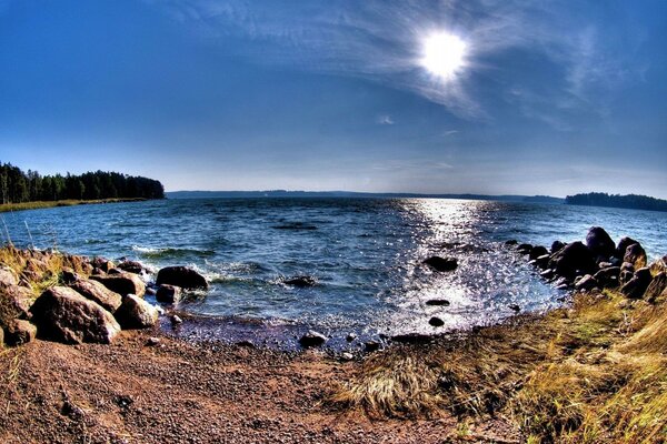 The shore of the raging sea surrounded by rocks