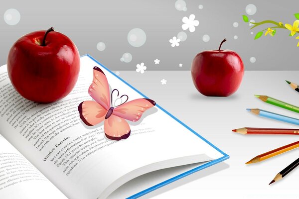 Pommes rouges et papillon sur le livre