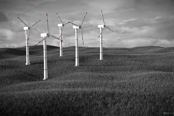 Windmills on a gray landscape background