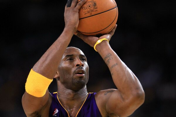 Photo of a basketball player with a ball in his hands