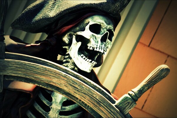 A dead pirate at the helm of a ship