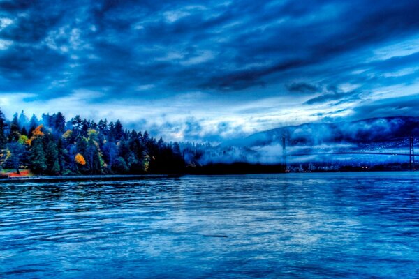 Cloudy sky over a calm river