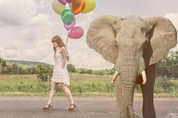 A girl with balloons and an elephant