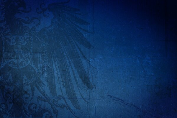 Escudo de armas con un águila sobre un pájaro sobre un fondo azul