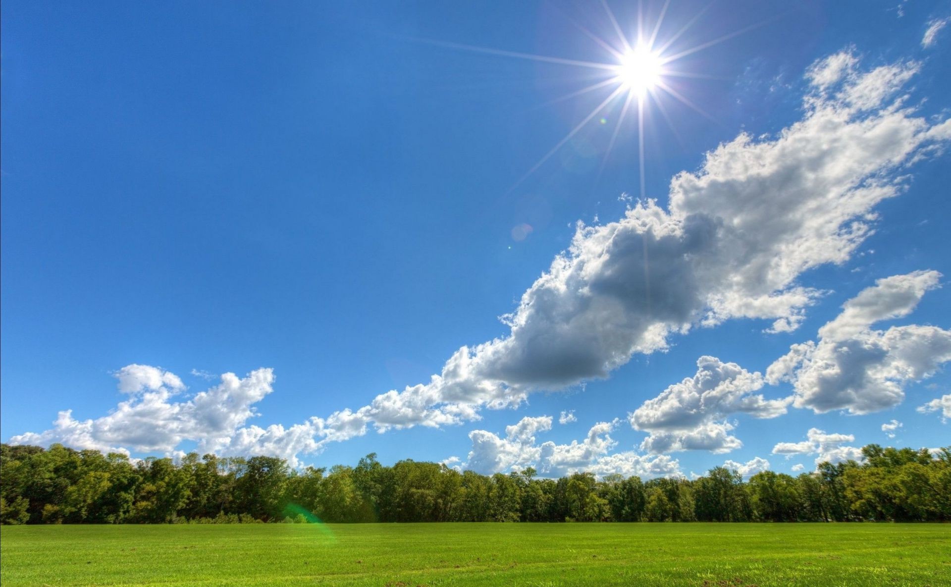 felder wiesen und täler landschaft natur himmel gras feld sonne ländliche gutes wetter heuhaufen landschaft sommer weide wolke bauernhof baum horizont landwirtschaft boden