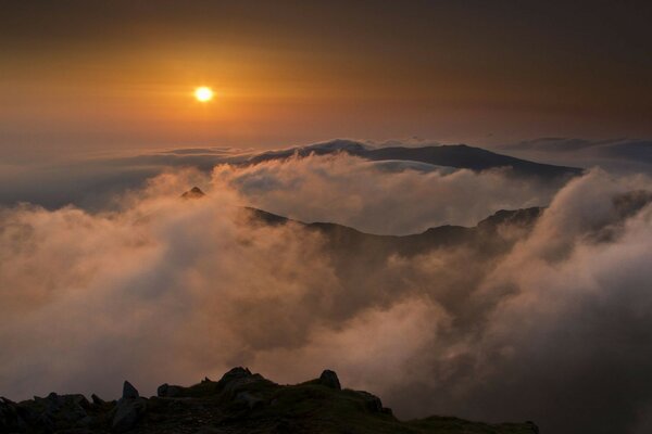 Sunset in the mountains with fog