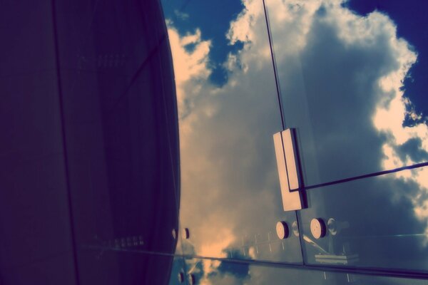 Reflection of clouds in a mirror cabinet