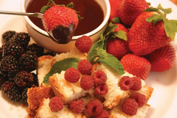 Chocolate fondue with strawberries, raspberries and blackberries