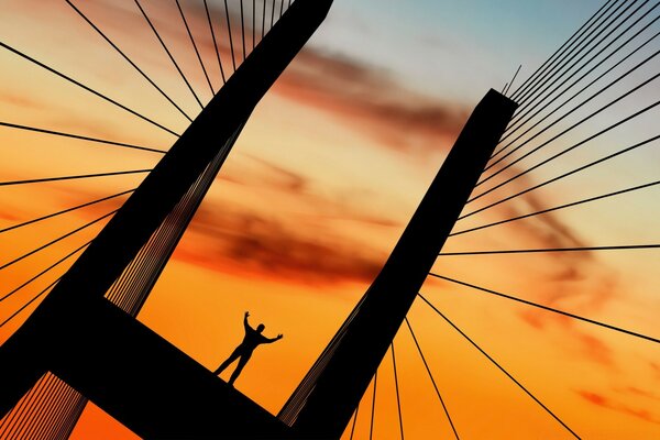 Homme coucher de soleil rouge sur le pont