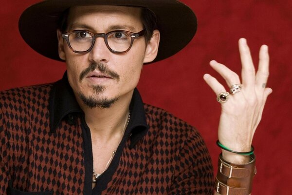 Johnny depp on a red background