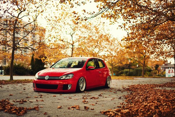 A vintage Volkswagen in autumn against the background of the city