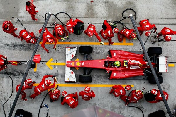 Red racing car and people in red