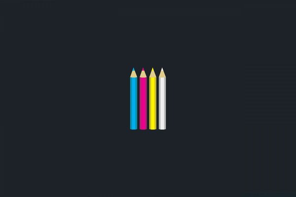 There are four colored pencils on a black background.