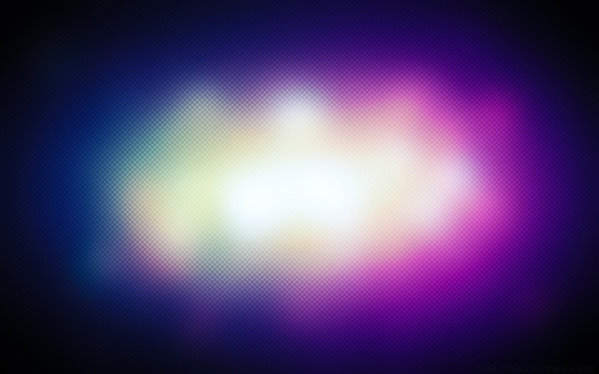 A blurry multicolored spot on a black background wallpaper