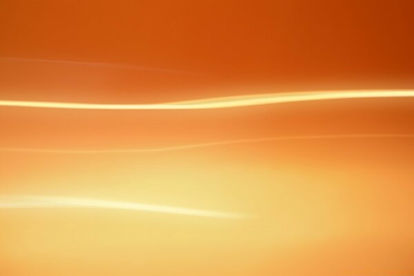 A bright stripe on the background of an orange blurred background