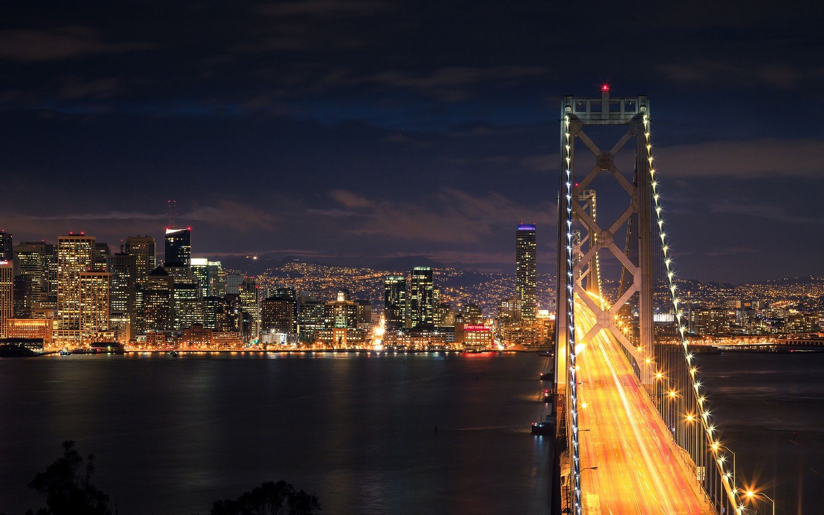 bridges bridge city water sunset dusk river travel architecture skyline evening downtown cityscape sky reflection urban suspension bridge skyscraper light tower