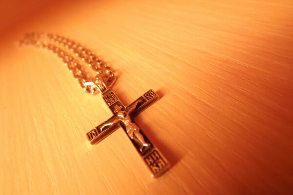 Chest cross on a chain in orange shades