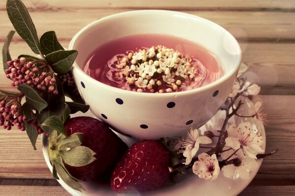 Still life of herbal tea with strawberries