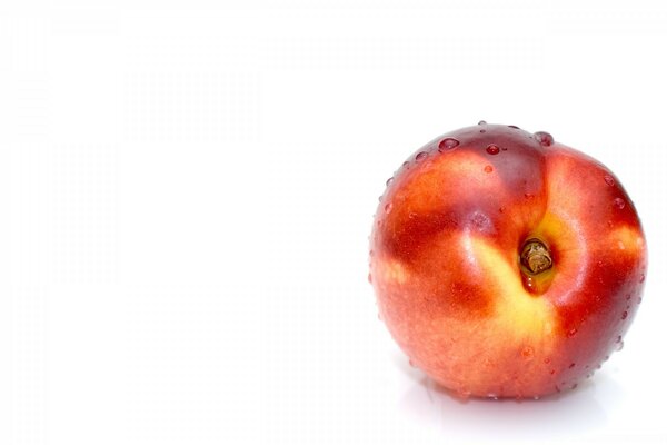 Juicy peach on a white background