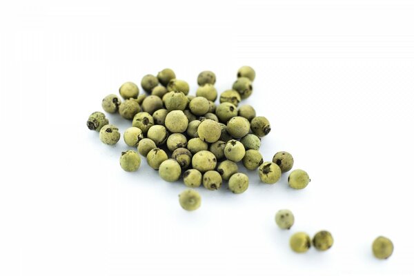 Green seeds on a white background