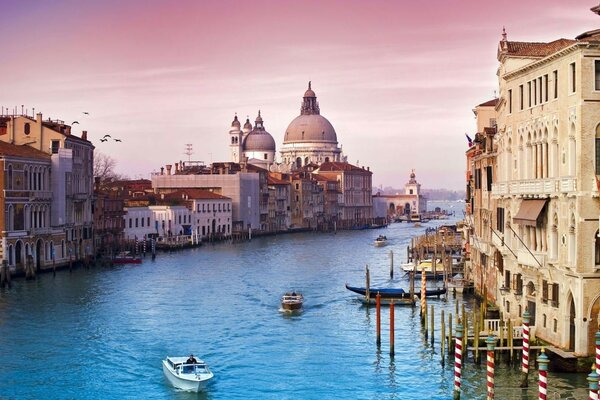 In the Venetian city, a canal with gondolas