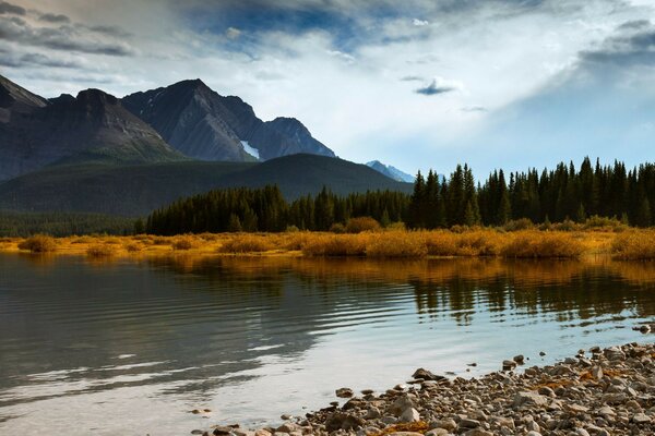 There is a mountain view on the river bank