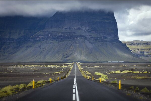 Desert canyon road under the clouds