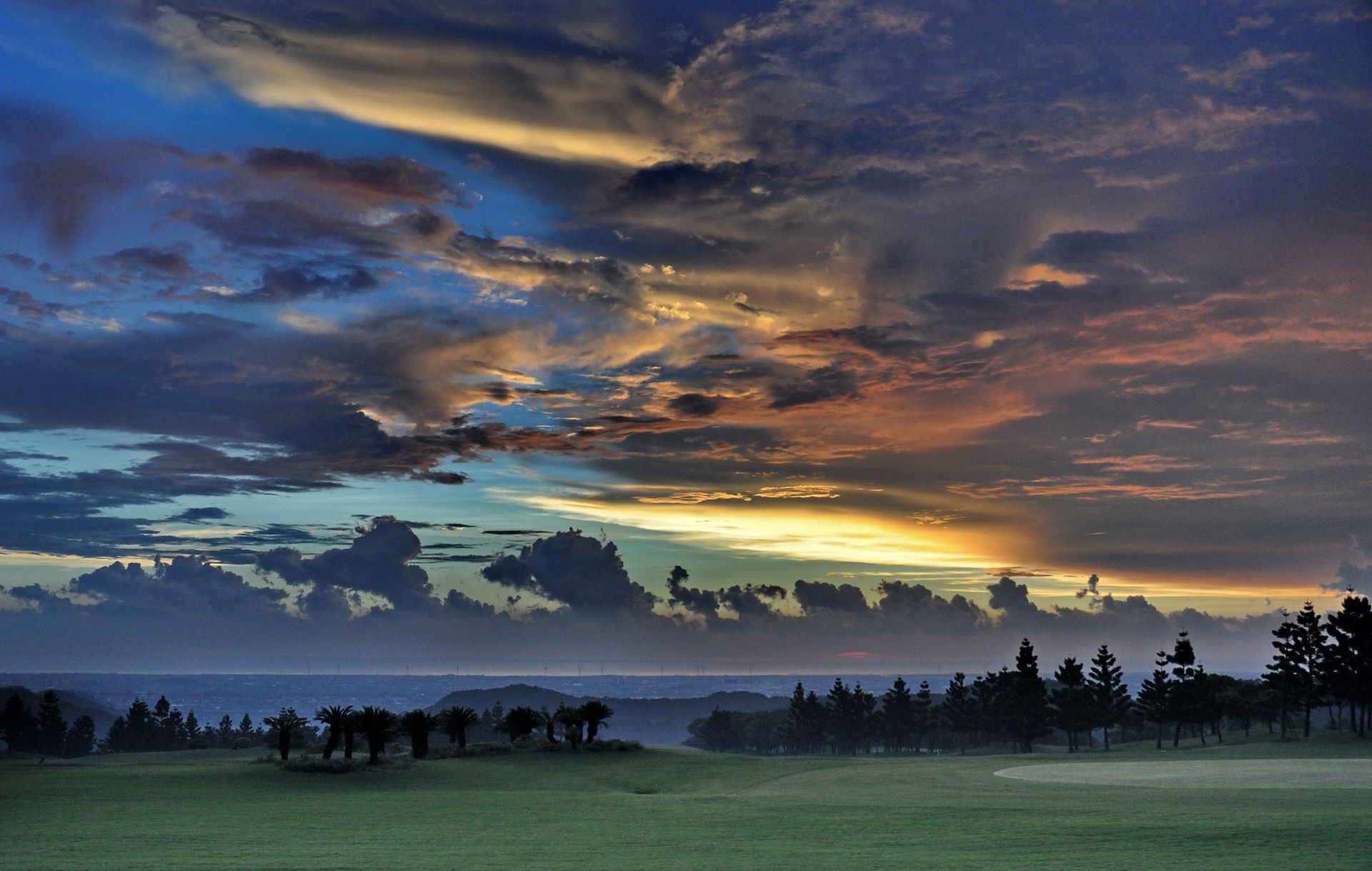 the sunset and sunrise sunset dawn water travel sky landscape outdoors evening sun nature lake tree daylight