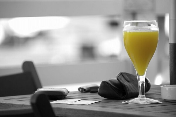 A glass with a drink at the bar