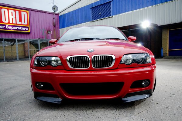 Red car on the background of the service