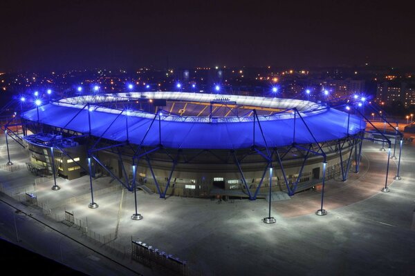 Sports stadium illuminated by blue lanterns