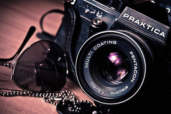 Retro photography of a camera and glasses