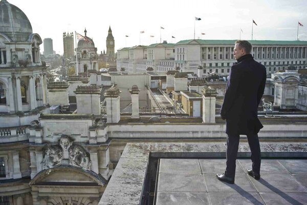 A man on the background of a gray city