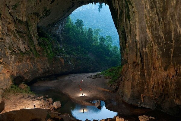 Cave in the evening. Water and nature