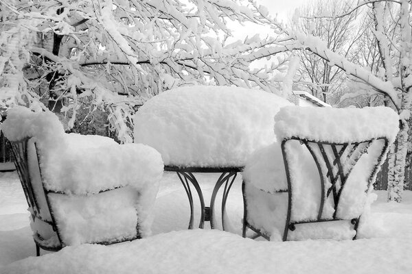 Garden furniture in snowdrifts