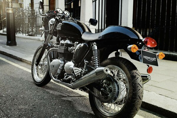 Blue motorcycle on the side of the road