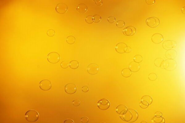 Soap bubbles on a yellow background