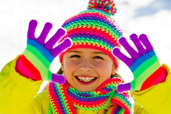 Laughing child on the street in winter